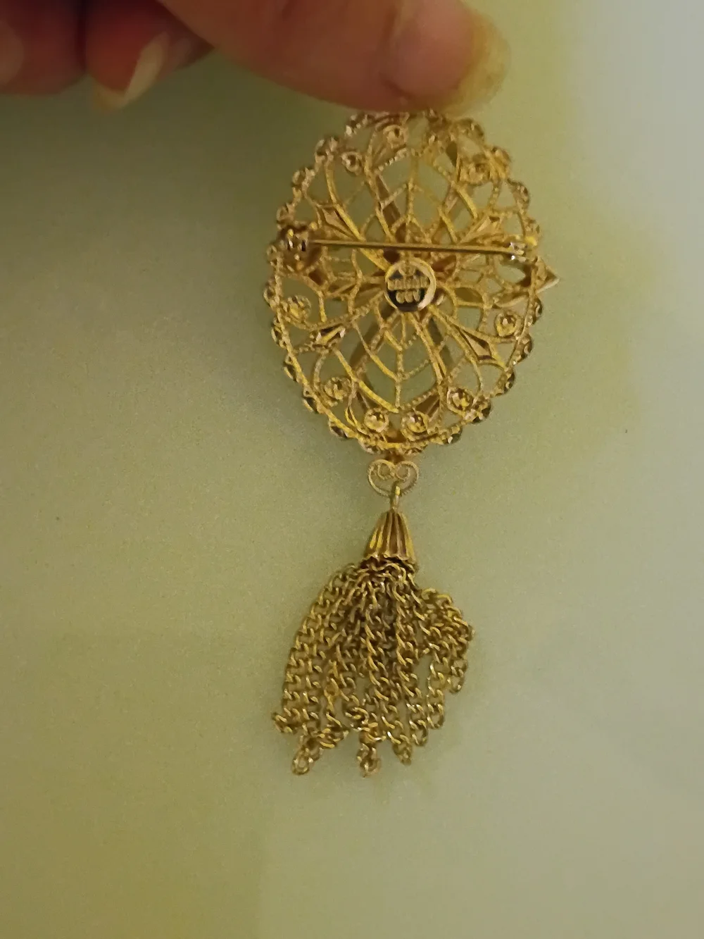 Sarah Cov Gold-Tone Filigree Brooch with Green Gem and Tassel